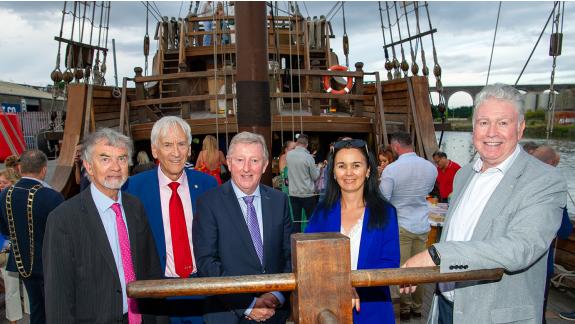 5 people standing on board a spanish galleon